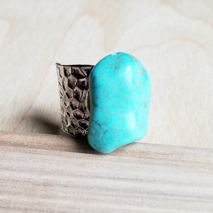 Turquoise stone cuff ring with textured silver cuff and open-ended design
