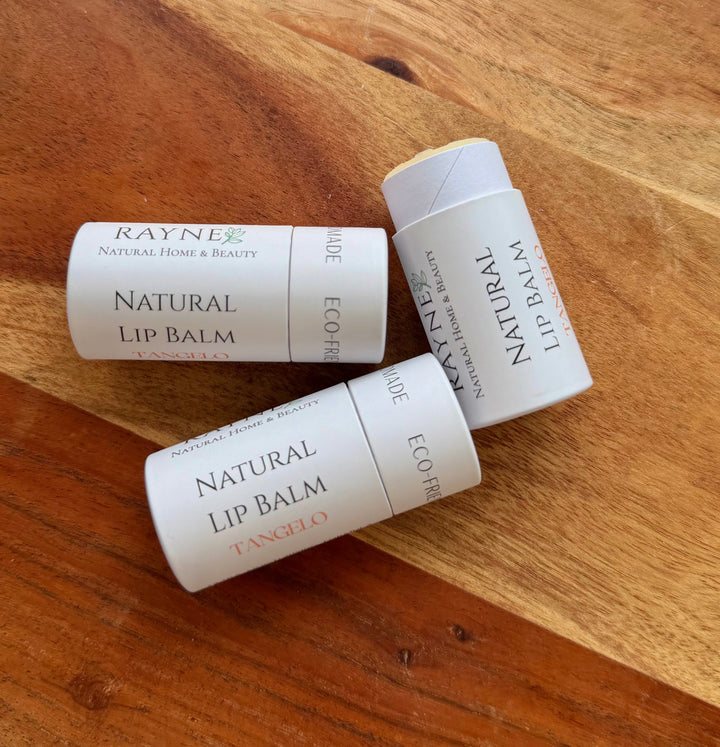 Natural lip balm tubes, white cardboard, labeled Natural Lip Balm and ECO FRIENDLY