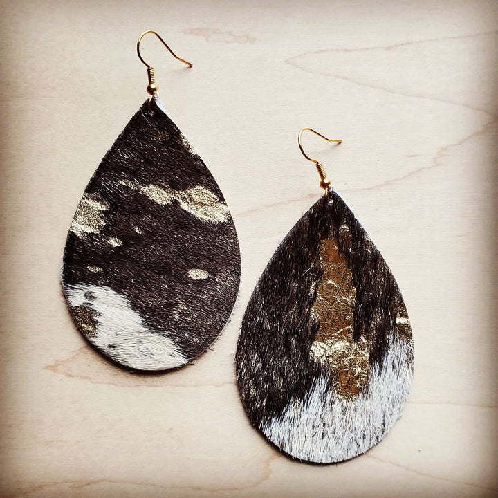 Cowhide teardrop earrings with gold fleck accents, dark brown and white spotted