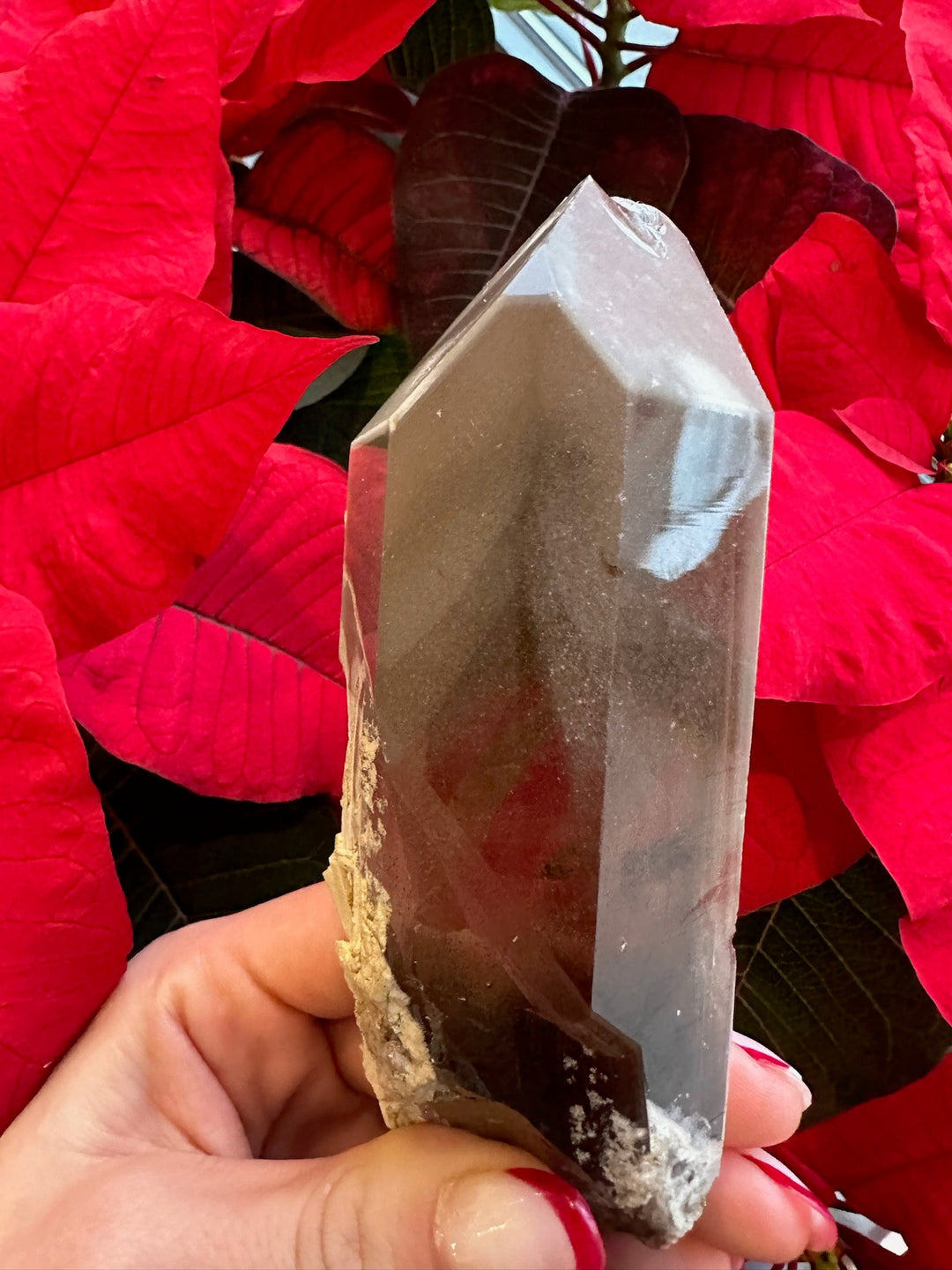Smoky quartz crystal point with internal phantom inclusions, natural tumbled texture