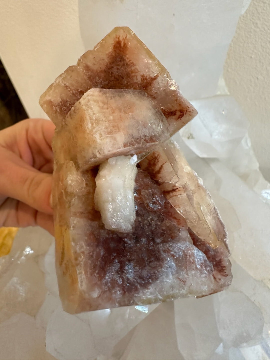 Brown-red apophyllite cube cluster with a white crystal core