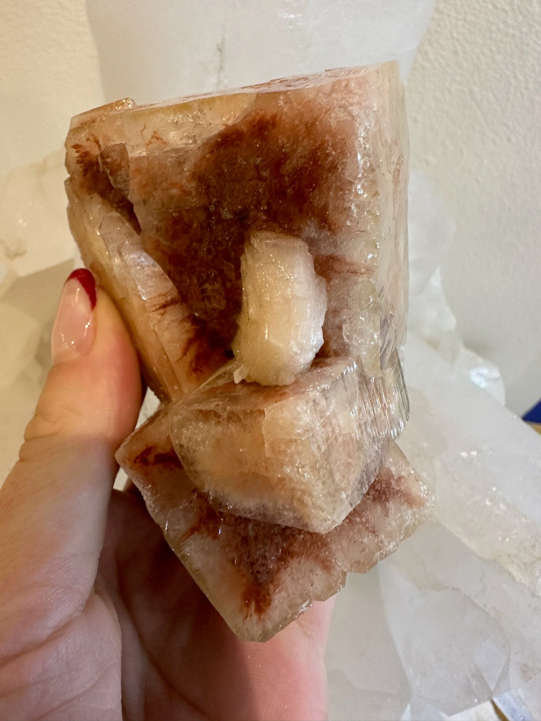 Warm red apophyllite cube cluster with layered clear crystals and white center