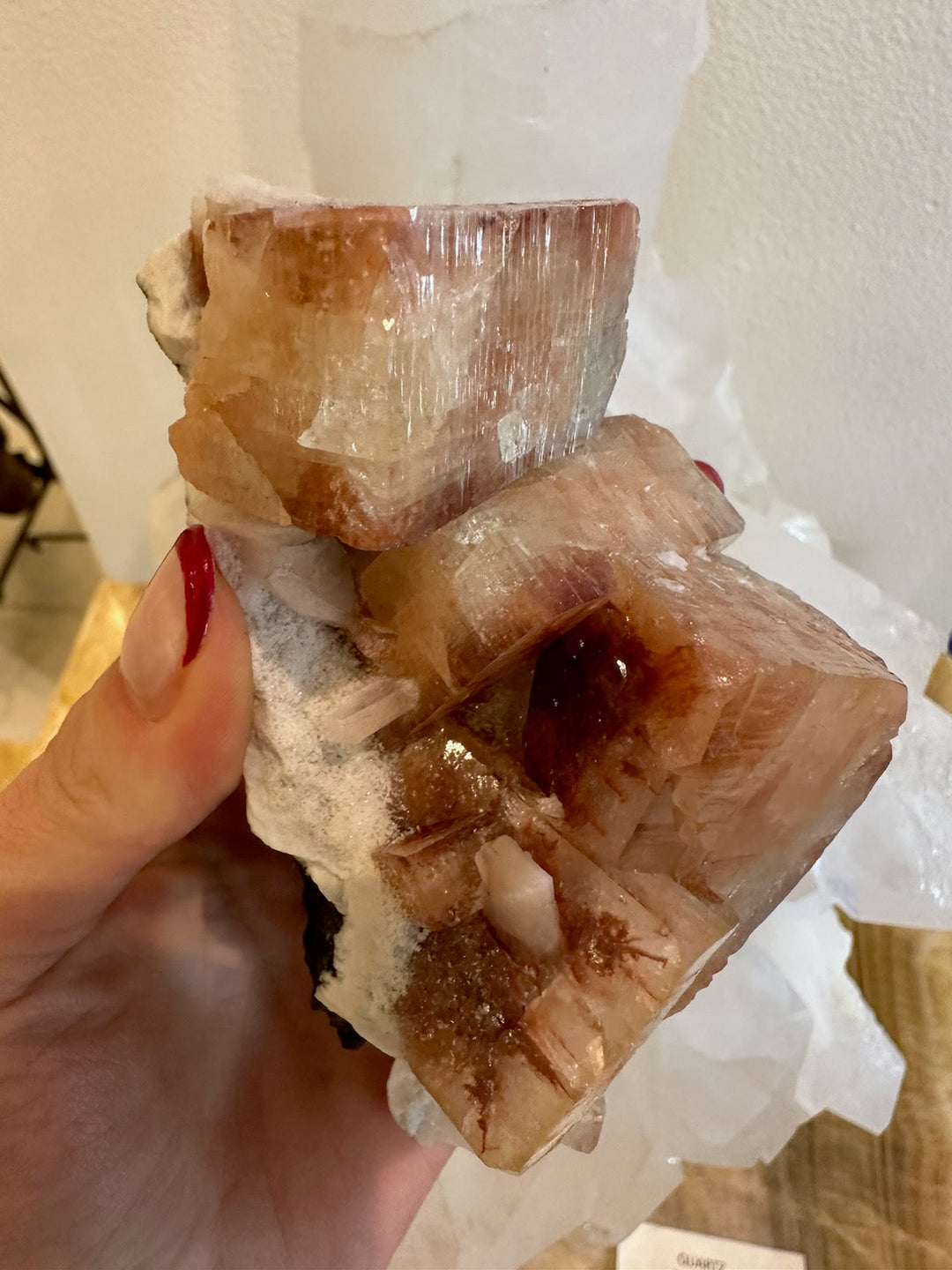Brownish-red apophyllite cubes with stilbite points on white rock matrix