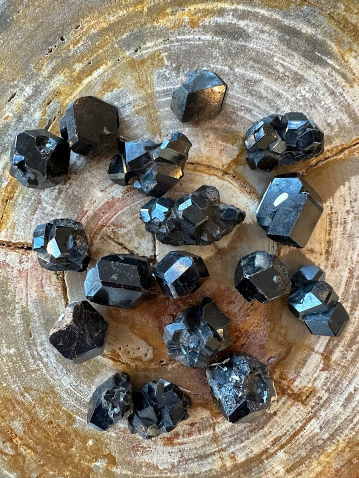 Rough melanite garnet crystal cluster with black and blue metallic facets