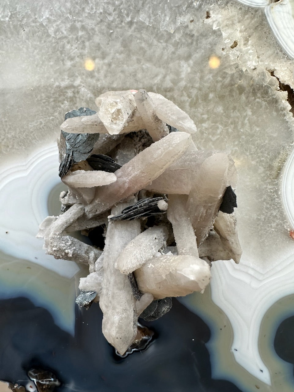 Dogtooth calcite cluster with mica, pale prismatic crystals and dark mica flakes