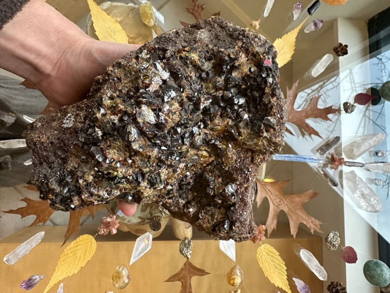 Large garnet crystal cluster specimen, uneven rough form with glittering silver and brown crystals