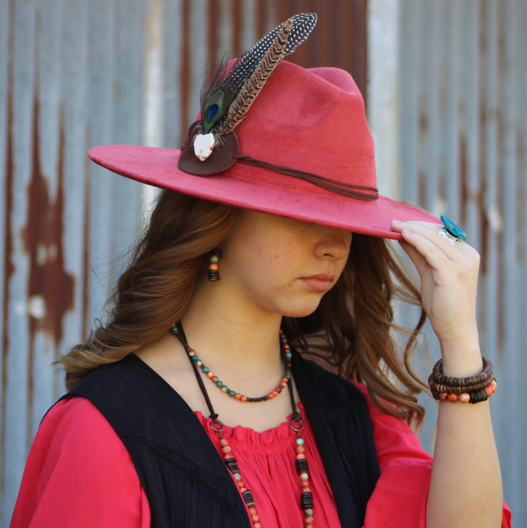Wrist stacked bracelets with turquoise and coral bead accents on dark elastic.