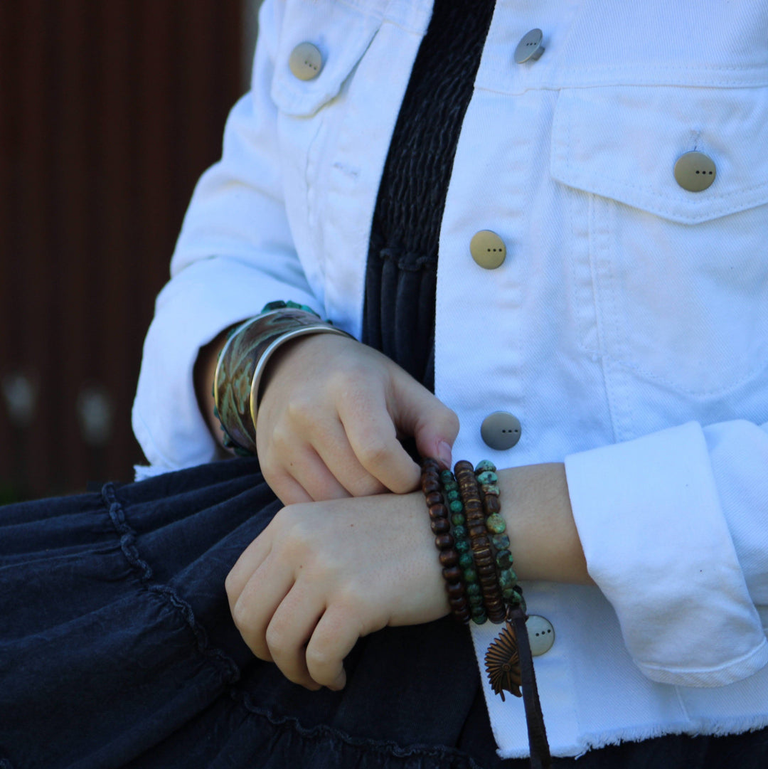 Wood beaded stretch bracelet with turquoise beads on black braided band