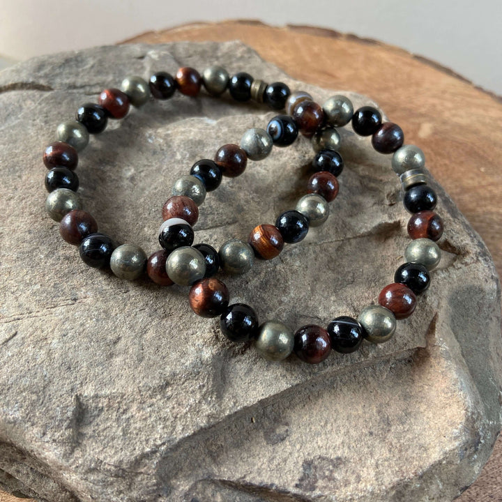 Tiger eye mix bead bracelet with black beads and red-brown and green stone accents.