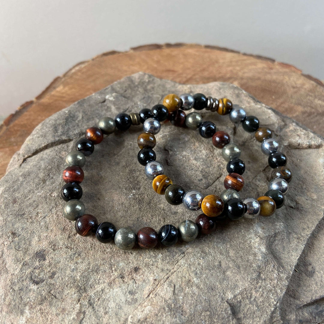 Bead bracelet with dark black and multicolor tiger eye stones and silver-tone accents.