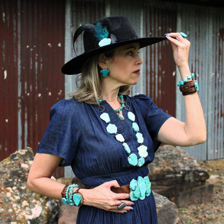 Turquoise slab earring studs worn by model, side angle with blue shapes