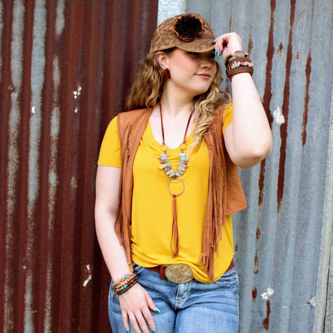 Red-brown slab stud earrings worn by model, metal posts visible