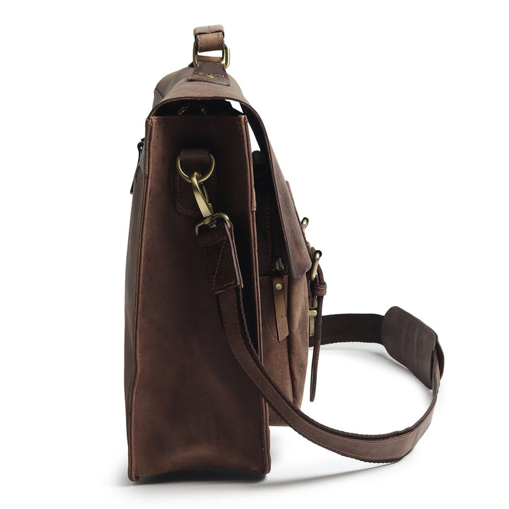 Brown leather messenger bag side view with crossbody strap and stitched pocket flap