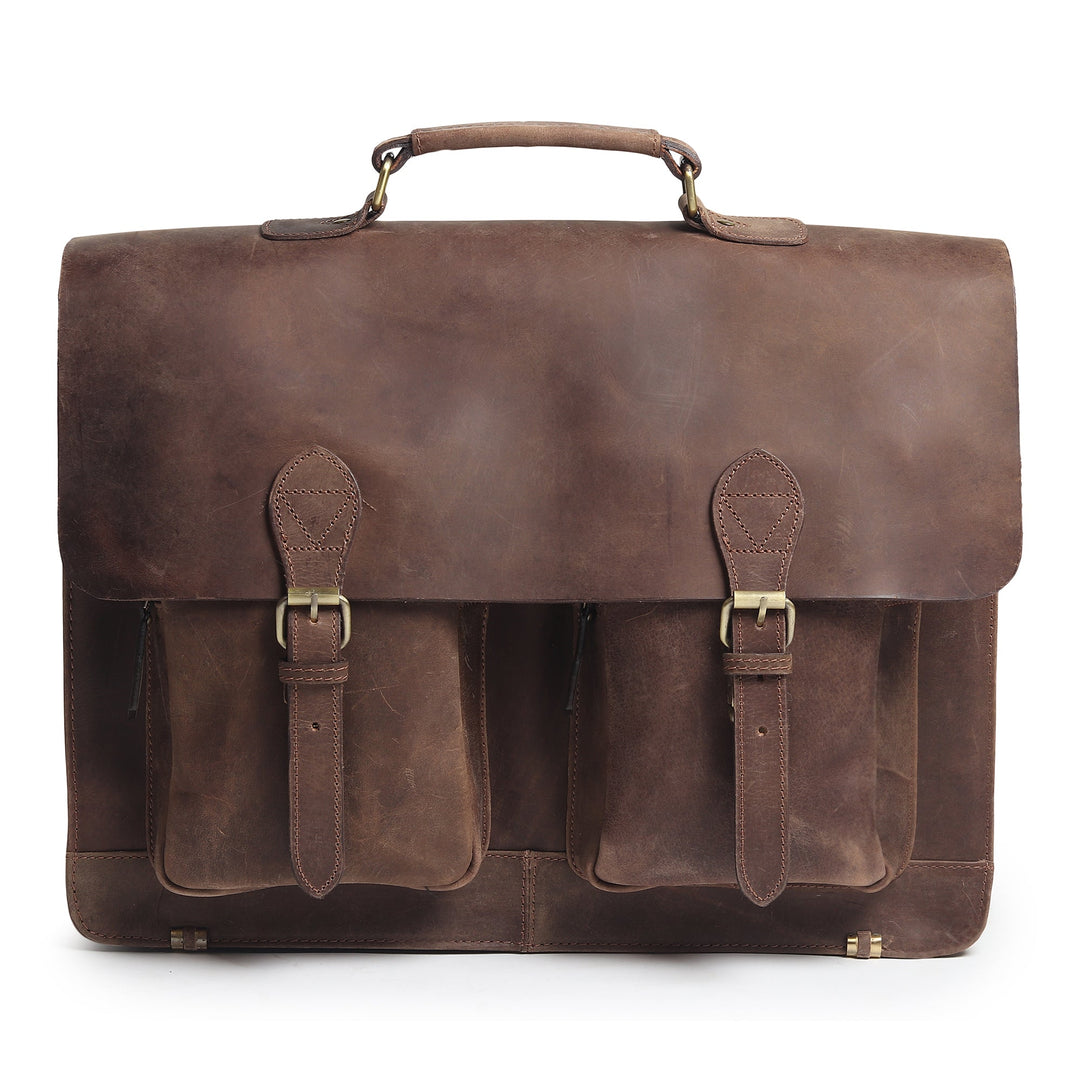 Brown leather messenger bag with top handle, flap closure, and front pocket panels
