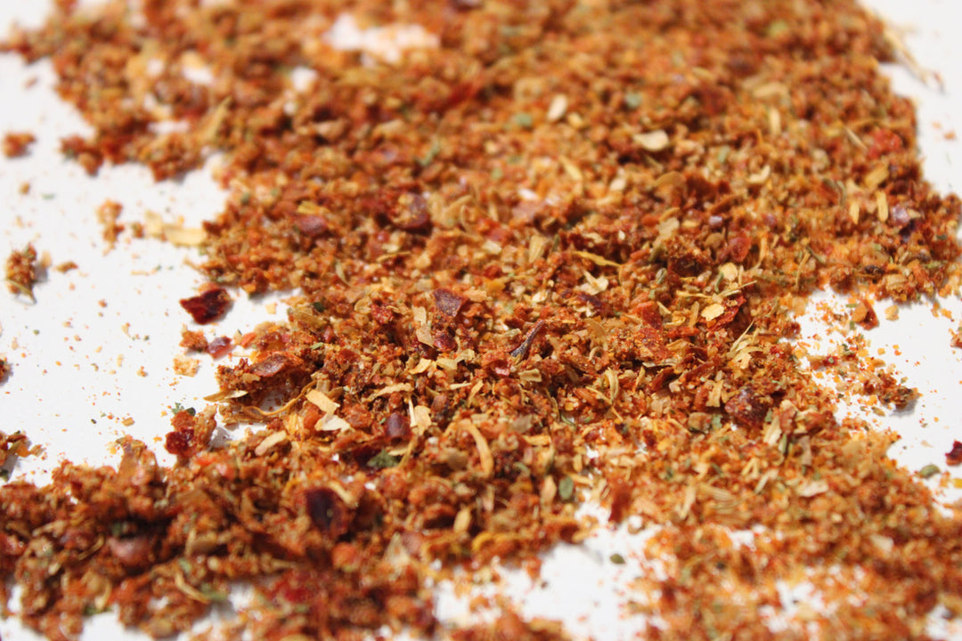 Adjika seasoning spice blend, finely ground with reddish-brown flakes