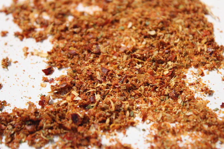 Adjika seasoning spice blend, finely ground with reddish-brown flakes
