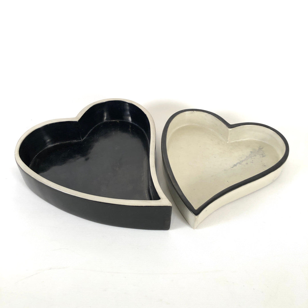 Heart-shaped bowl set in black and white, with cream outer rims and scalloped shape
