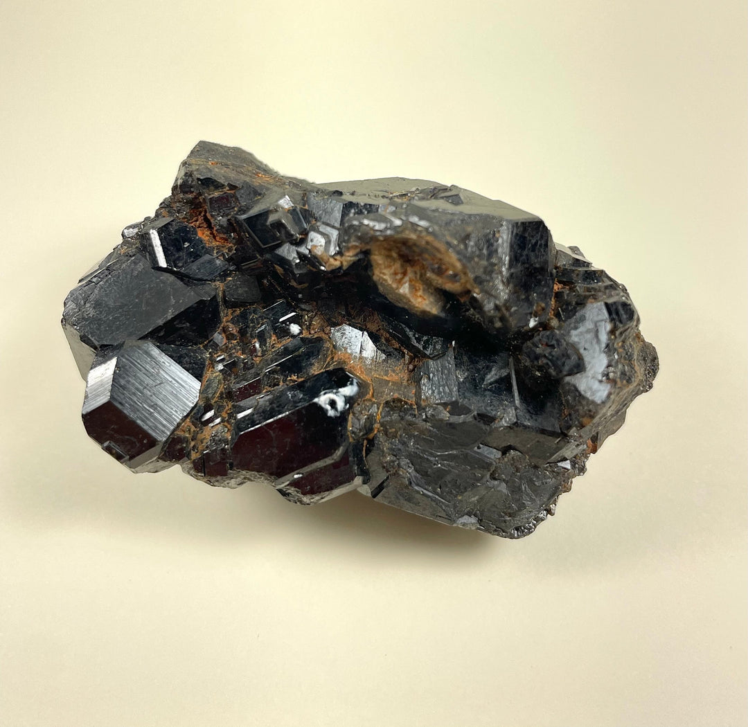 Melanite garnet cluster mineral with dark crystals and rust-brown speckles