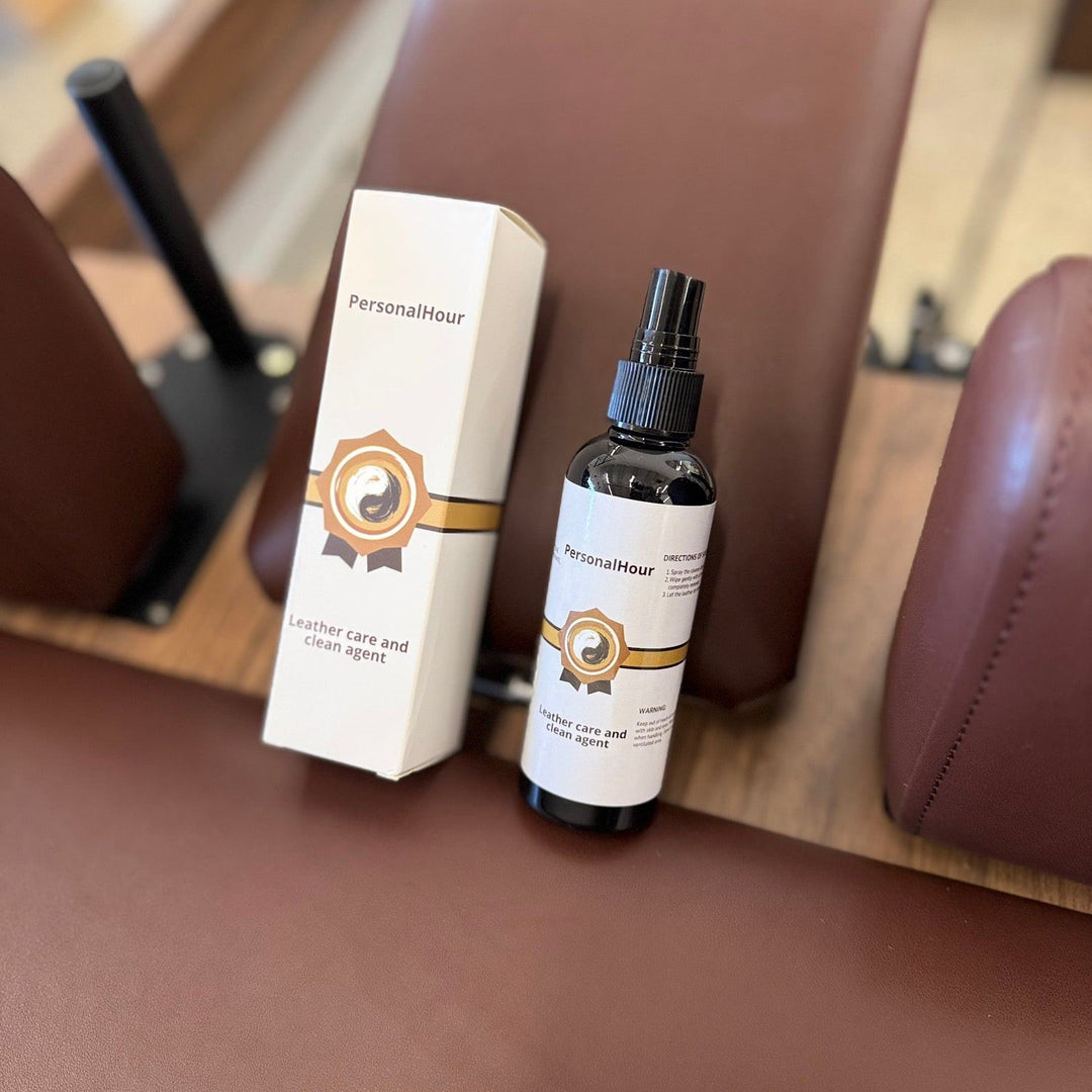Leather care spray bottle with white carton and brown-gold logo