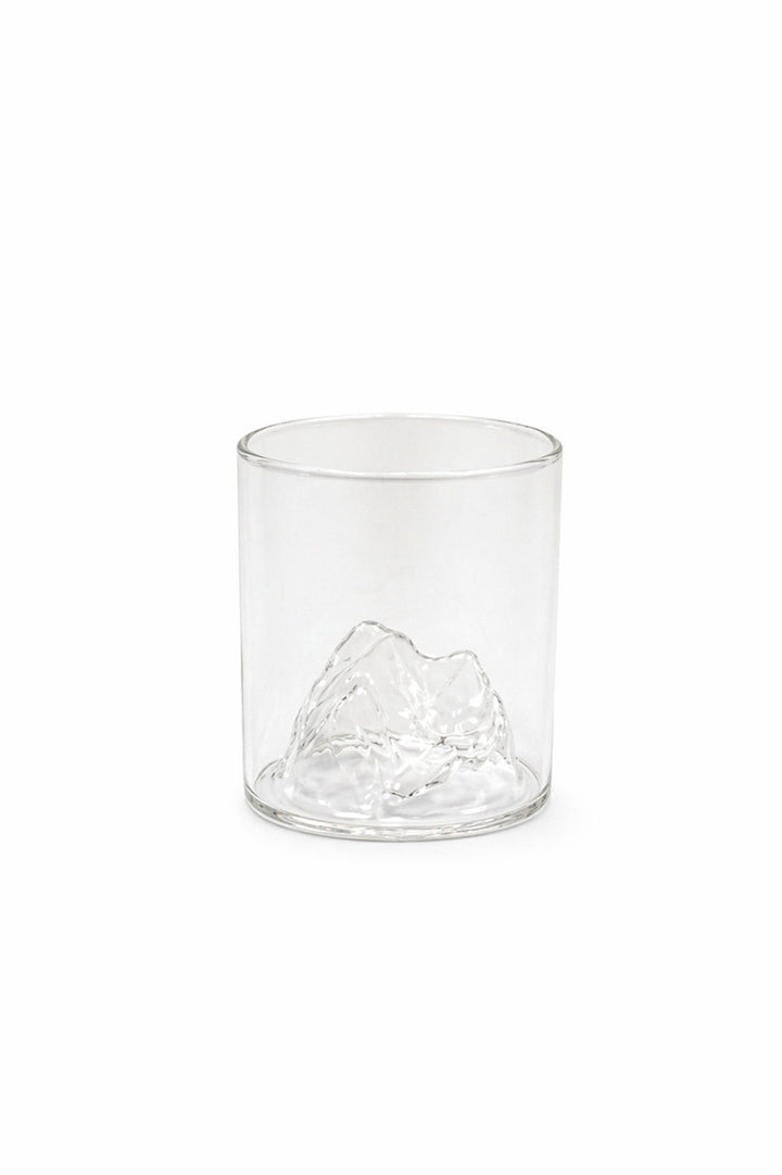 Clear whiskey tumbler with mountain range etched design and thick base