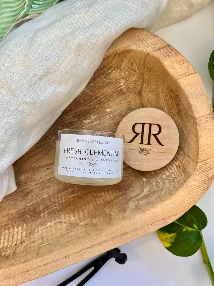 Coconut soy candle with Fresh Clementine label, wooden lid with monogram on tray