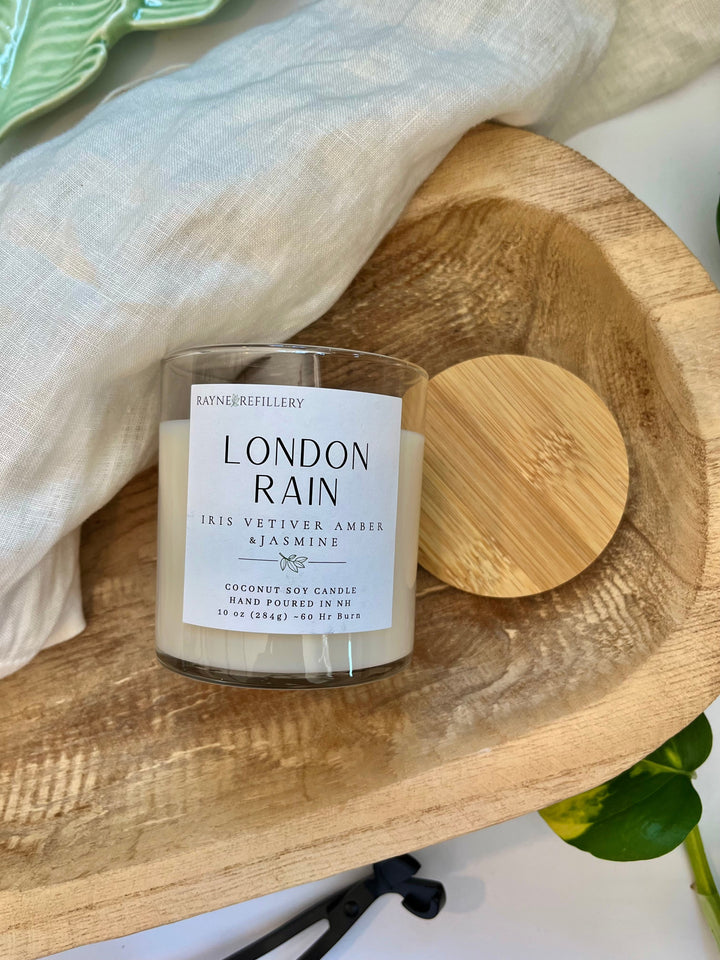 London Rain coconut soy candle in white jar with wooden lid, label visible