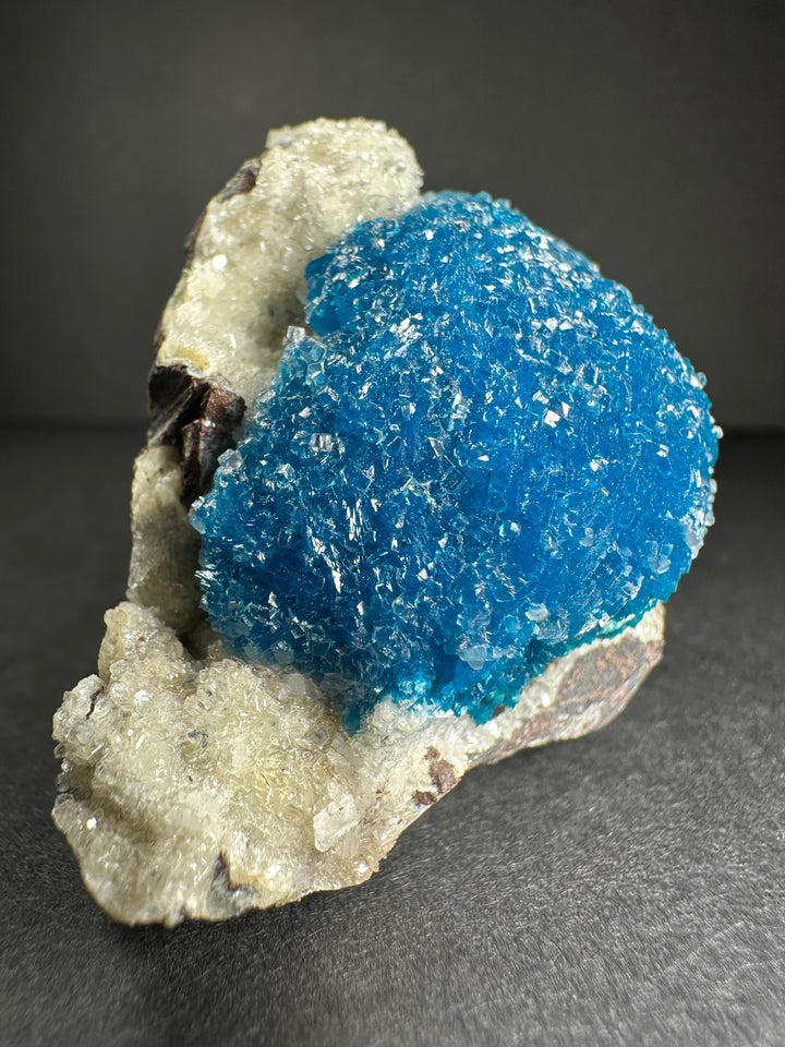Blue cavansite on stilbite matrix specimen with pale crystals and dark rock