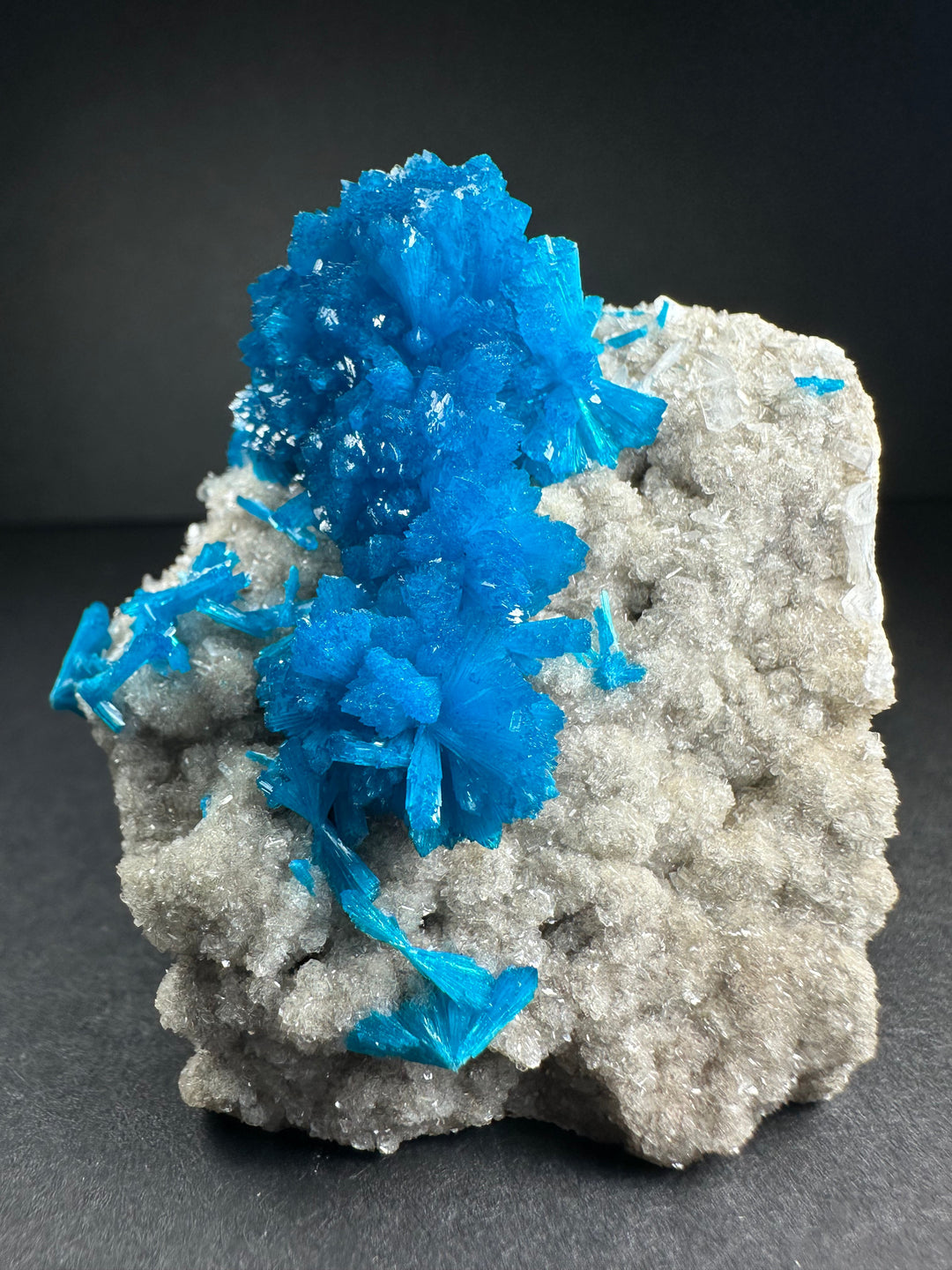 Blue cavansite crystals on white stilbite with gray rock matrix specimen