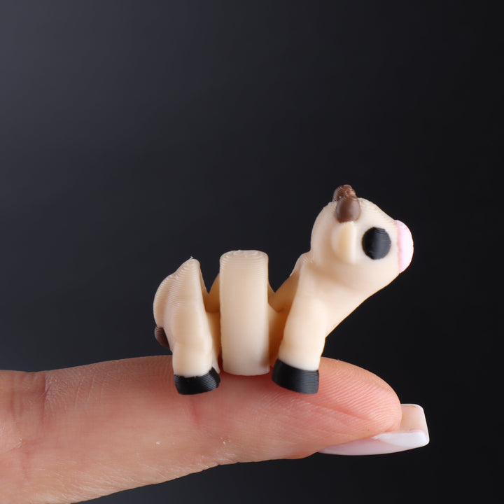 Cream and brown animal fidget toy with black hooves and rounded snout