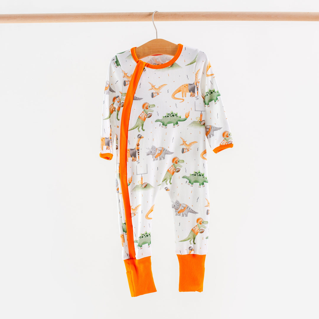 Kids long-sleeve pajama set, white with dinosaur scene print and bright orange trim