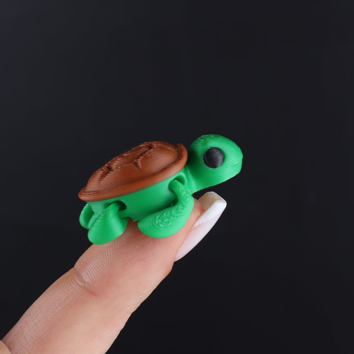 Green and brown animal fidget toy with oval top cap and small protrusions