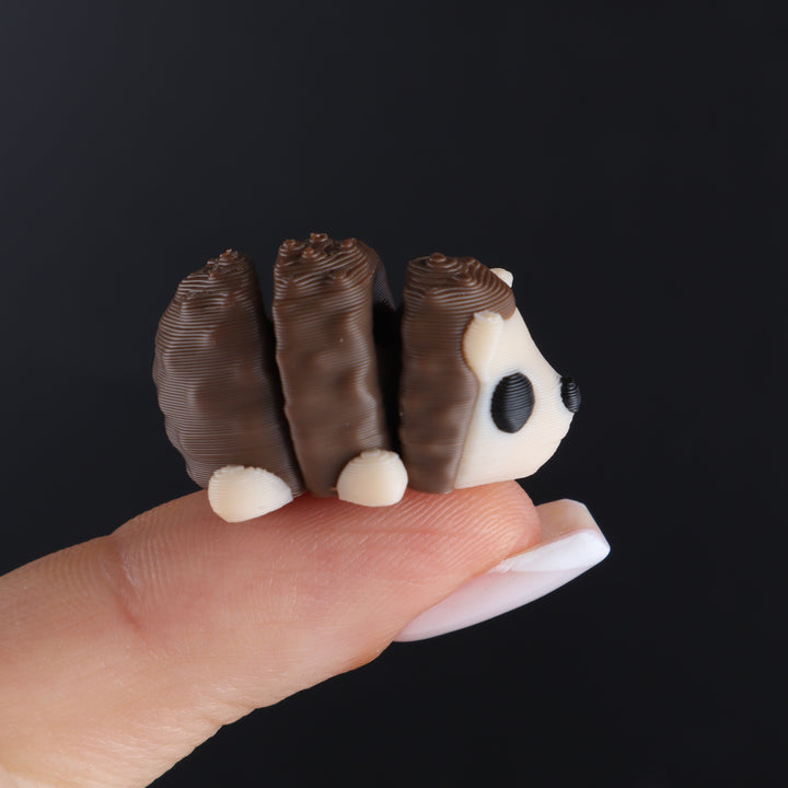 Brown-and-cream animal fidget toy set in a row with black oval eye marks
