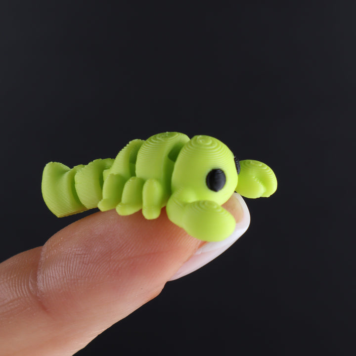 Lime green animal fidget toy with spiral tail and round black eye