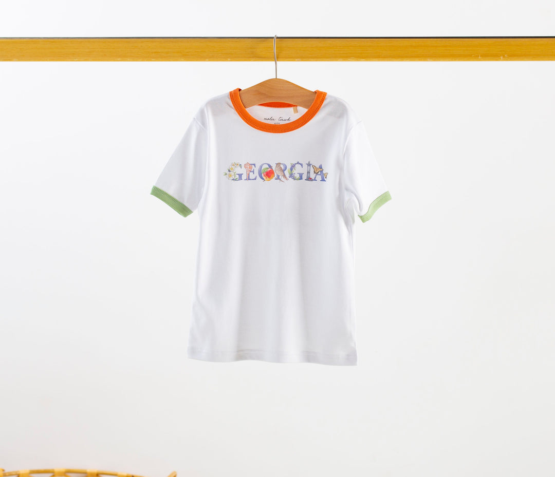 White organic cotton tee with orange collar, green cuffs, and front Georgia graphic