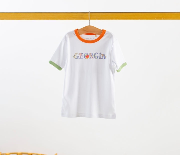 White organic cotton tee with orange collar, green cuffs, and front Georgia graphic