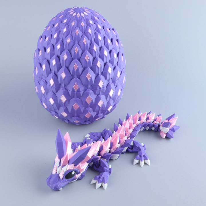 Crystal baby dragon fidget toy with matching purple faceted egg, articulated body
