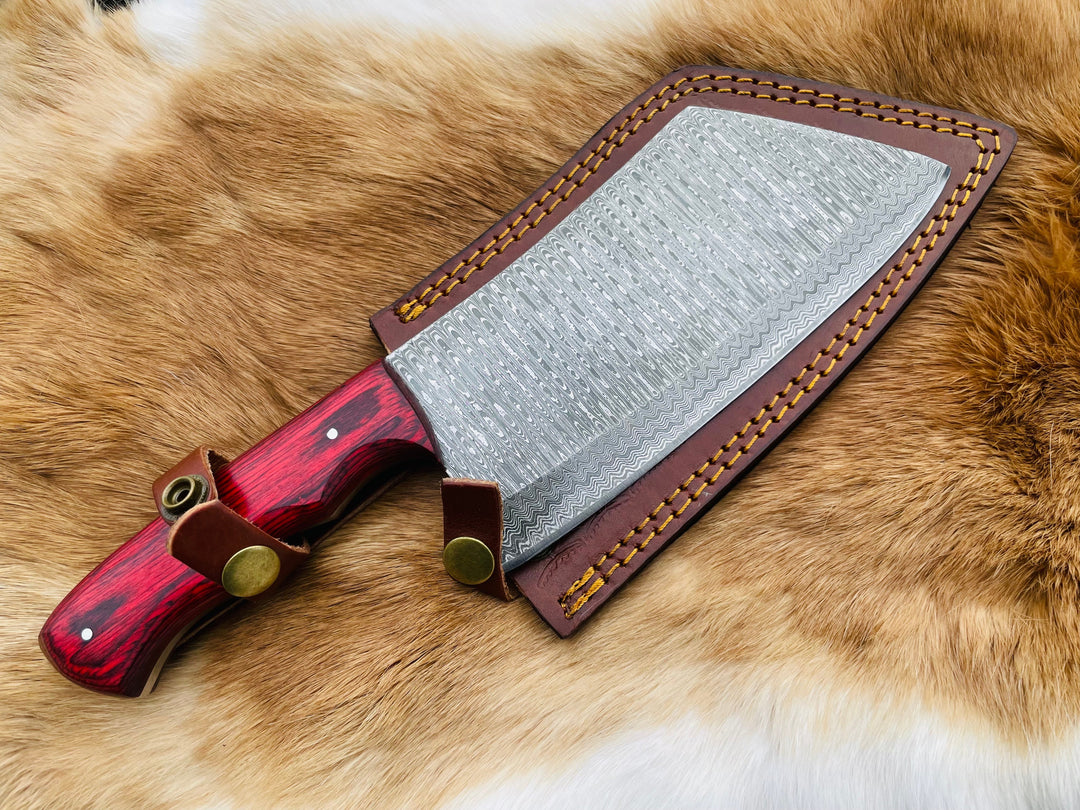 Damascus cleaver with red handle and brown leather sheath with brass snaps