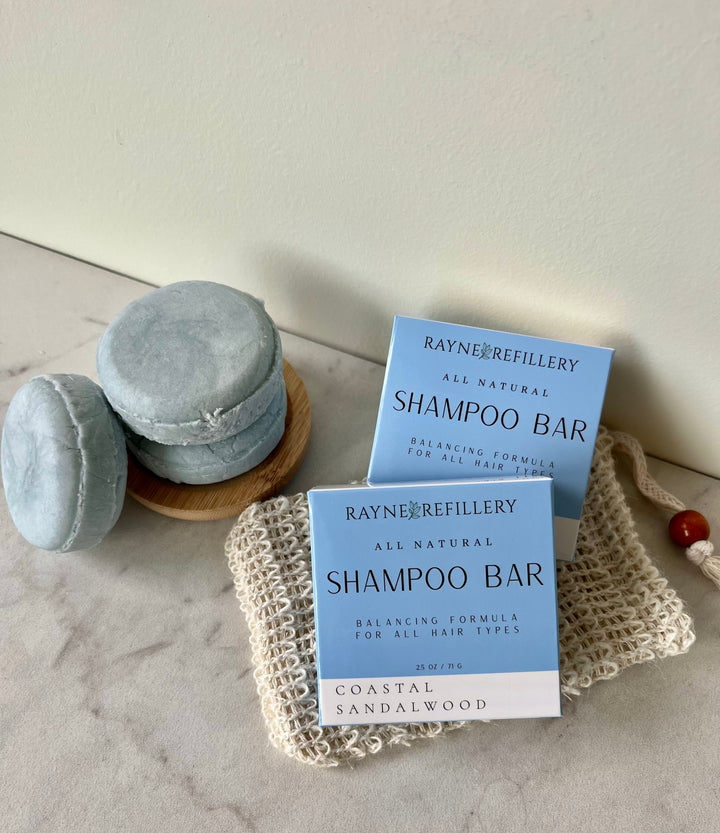 Solid shampoo bars with Coastal Sandalwood gray-blue bars and a matching box