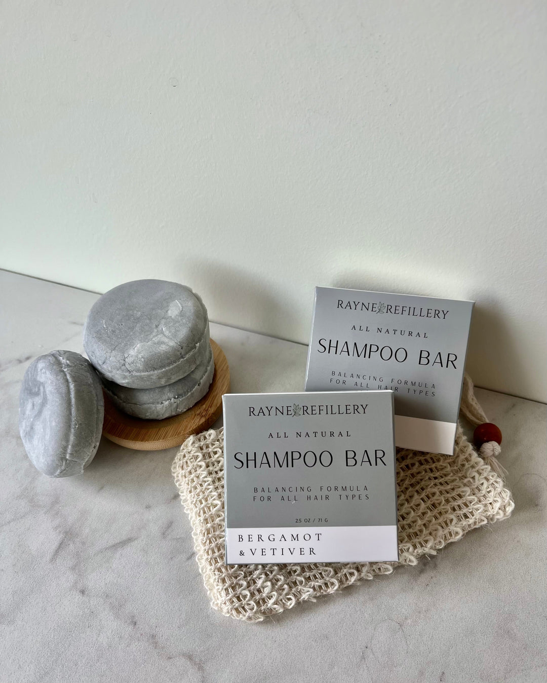 Solid shampoo bars with Bergamot & Vetiver gray bars and a matching box