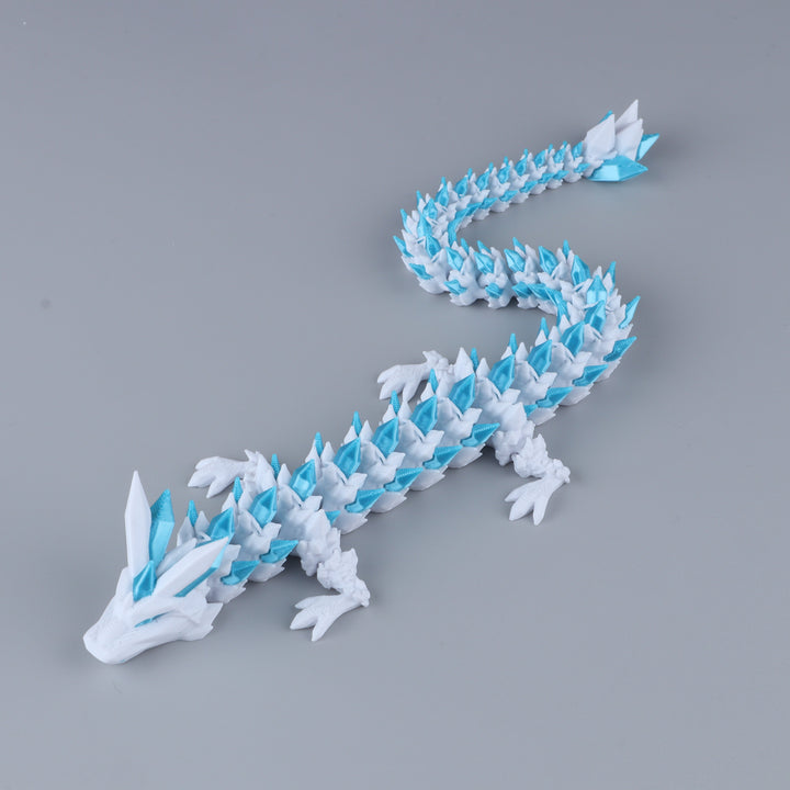 White and light-blue crystal articulated dragon fidget toy with faceted body and tail