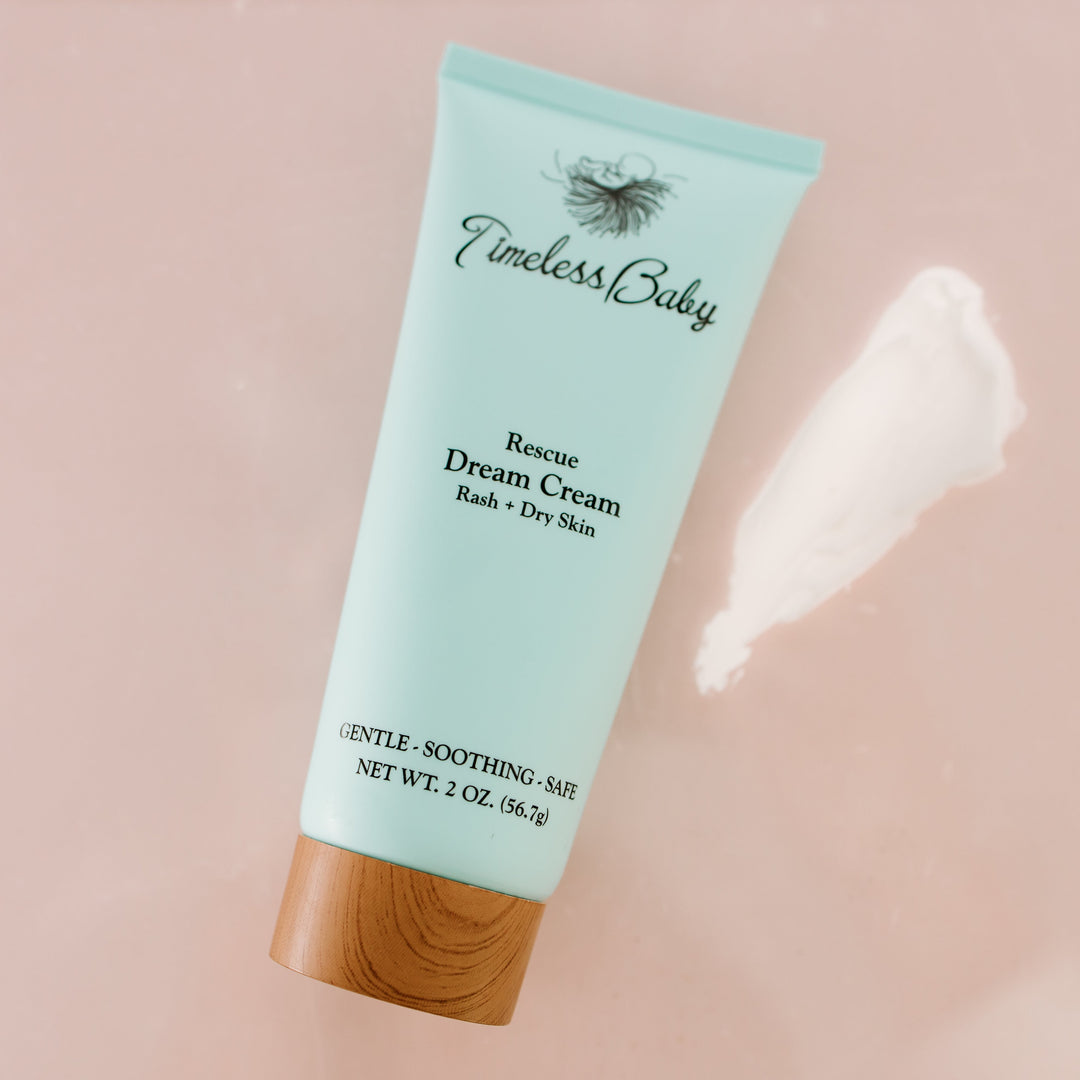 Angled light blue Rescue Dream Cream baby cream tube with wood base
