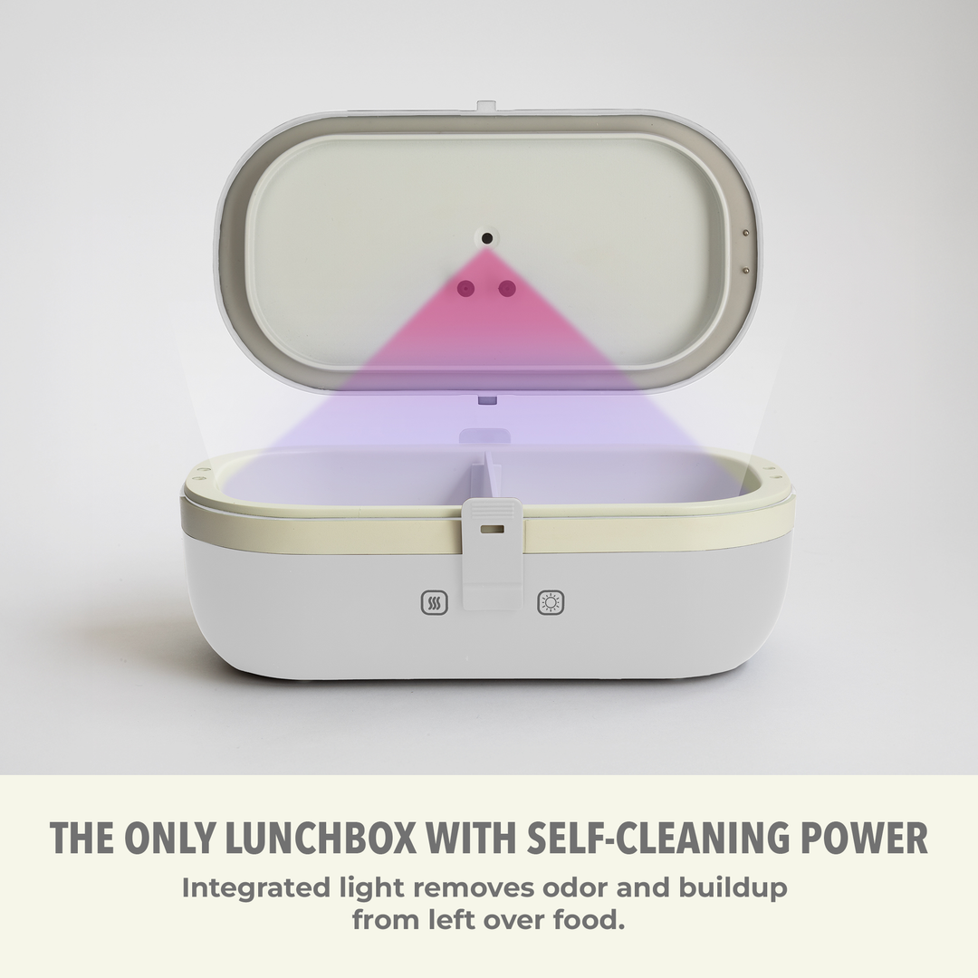 Self-heating lunch box with lid open, built-in UV light indicator visible inside.
