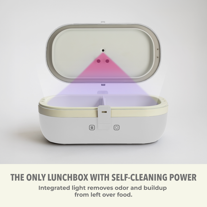 Self-heating lunch box with lid open, built-in UV light indicator visible inside.