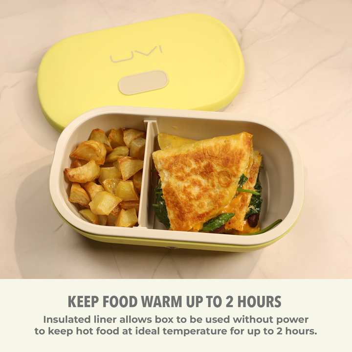 Self-heating lunch box with yellow lid open, holding hot meal in divided tray.