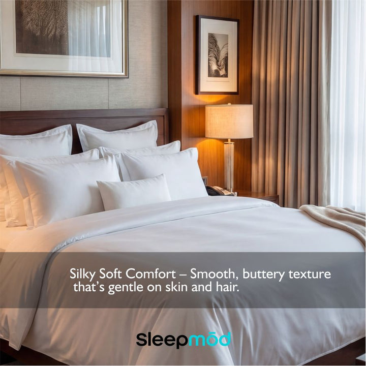 White sheet set with matching pillows on a made bed