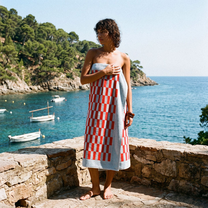 Cotton checkered beach towel in red-and-white grid pattern