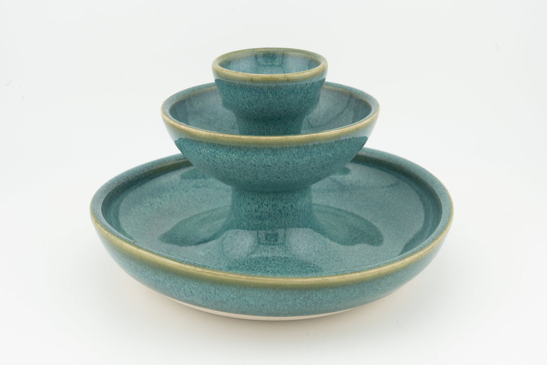 Teal ceramic jewelry fountain set with central cup and shallow saucer