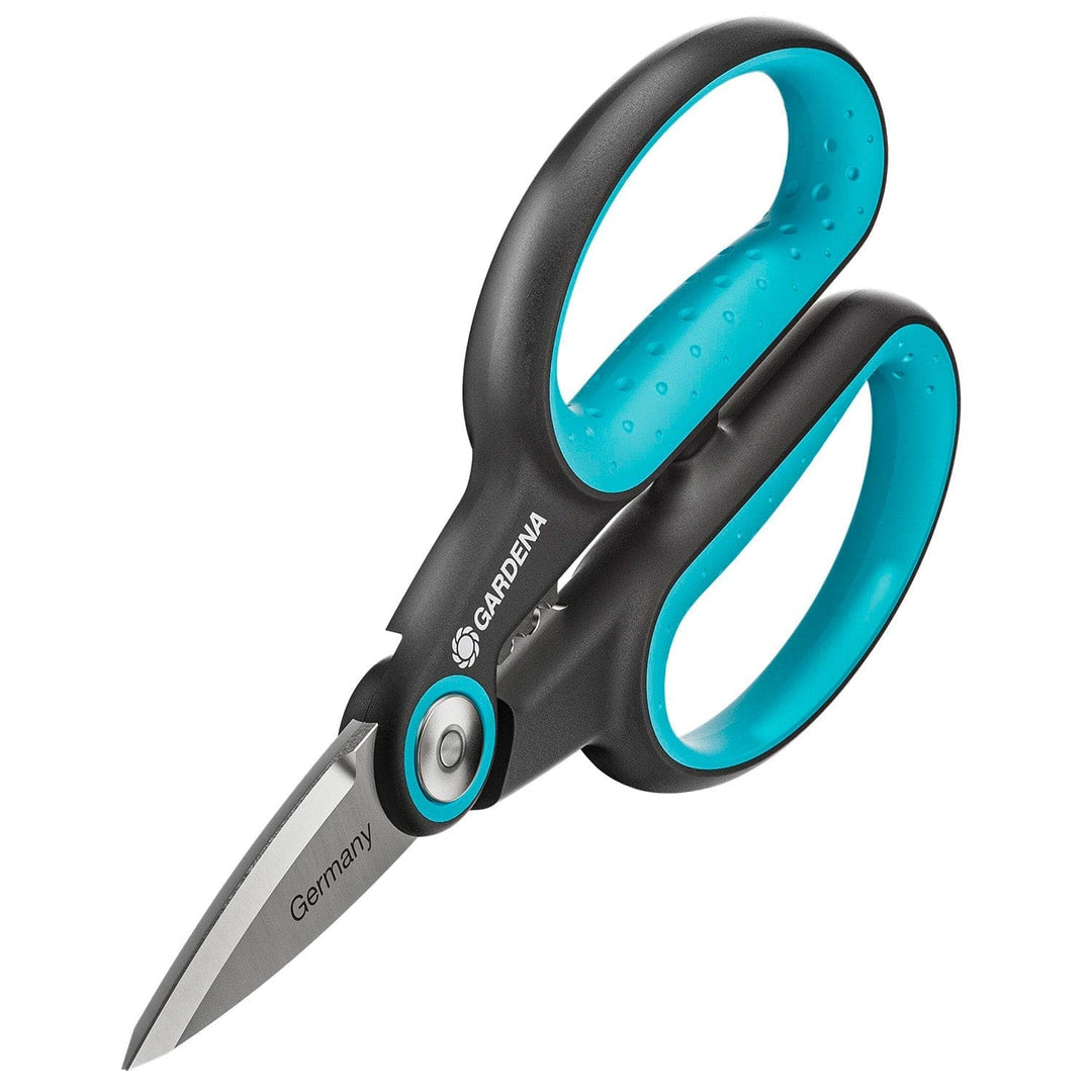 Herb scissors with teal grip rings and stainless blades, angled close-up