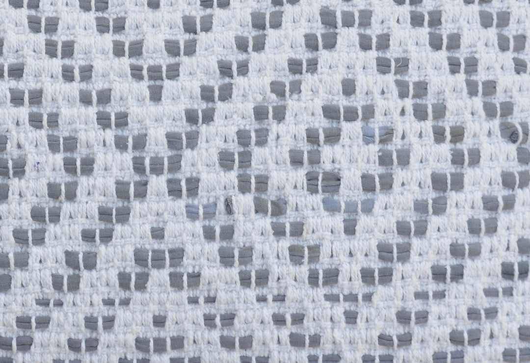 Woven cotton pillow fabric with repeating dotted grid pattern, white and gray