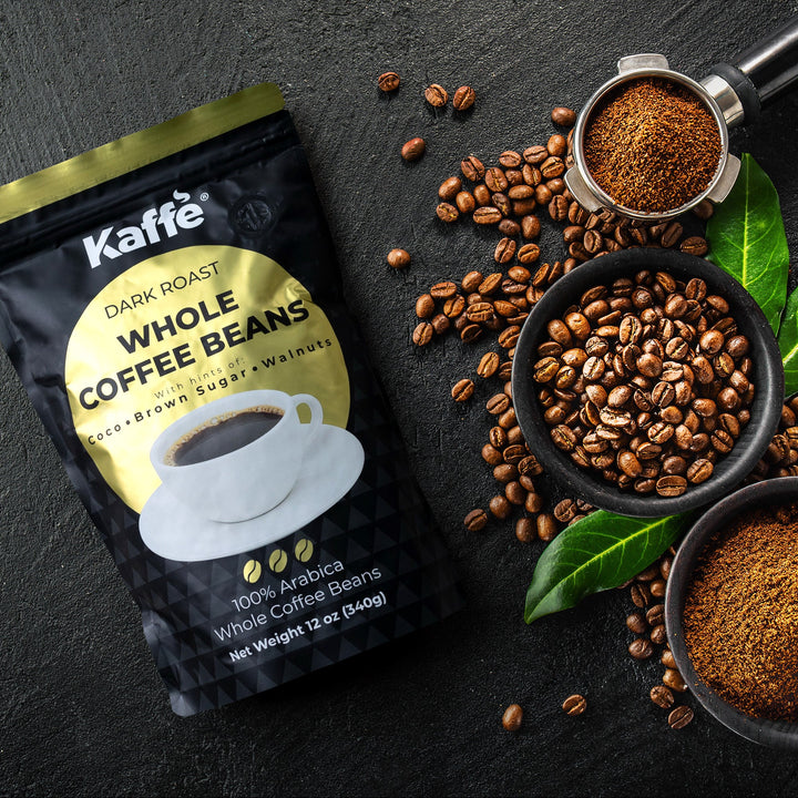 Dark roast whole coffee beans pouch beside coffee beans and espresso grinder